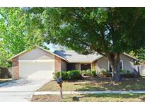 Charming single-story home with brick accents and a well-maintained front yard at 984 Dinero Dr, Winter Springs, FL 32708