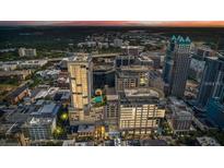 Stunning aerial view of the city skyline at sunset, highlighting the building's central location at 155 S Court Ave # 2406, Orlando, FL 32801