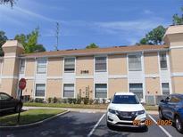 Charming condominium featuring well-maintained landscaping and reserved parking at 3166 S Semoran Blvd # 1007, Orlando, FL 32822