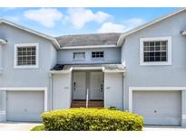 Exterior of a charming townhouse showcasing the architecture and well-maintained landscaping at 425 Eagle Ridge Dr # 425, Davenport, FL 33837