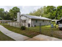 Charming single-story home featuring a fenced yard and a traditional architectural style at 715 Ballard St, Altamonte Springs, FL 32701
