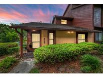 Charming condo showcasing a well-manicured lawn and beautiful earth-tone finishes at 1017 Love Ln # 34, Apopka, FL 32703
