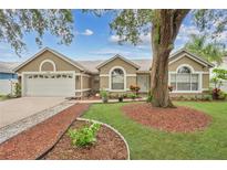 Charming single-story home with manicured lawn, mulch beds, and a well-maintained exterior at 1040 Big Oaks, Oviedo, FL 32765