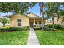 Charming one-story home featuring a well-manicured lawn and inviting covered porch at 1286 Tallow Rd, Apopka, FL 32703