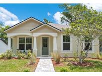 Charming single-story home with inviting front porch and manicured landscaping at 1371 Lake Dr, Casselberry, FL 32707