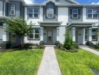 Beautiful townhome with well-manicured lawn and inviting facade at 1407 Mount Royal Dr, St Cloud, FL 34771