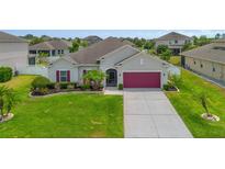 Charming single-Gathering home boasts a manicured lawn and beautiful landscaping at 2518 Hayden Valley St, Apopka, FL 32703