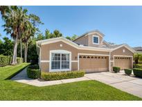 Charming townhouse with a well-manicured lawn, lush greenery, and inviting curb appeal at 432 Harbor Winds Ct, Winter Springs, FL 32708