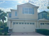 Charming home featuring a two-car garage, well-maintained landscaping, and inviting curb appeal at 1625 Priory Cir, Winter Garden, FL 34787