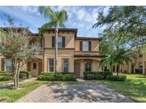 Charming two-story home with a well-manicured lawn and inviting curb appeal at 4143 Calabria Ave, Davenport, FL 33897
