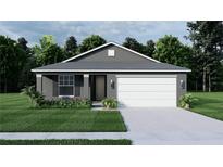 Charming single-story home featuring a two-car garage, landscaped front yard, and neutral stucco siding at 371 Miller Rd, Sanford, FL 32773
