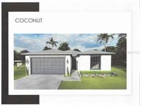 Charming single-story home featuring a two-car garage, manicured lawn, and lush landscaping at 371 Miller Rd, Sanford, FL 32773