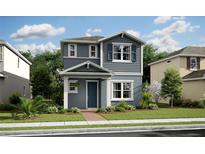 Charming two-story home with blue accents, a well-manicured lawn, and inviting curb appeal at 12536 Westhaven Oak Dr # 111, Winter Garden, FL 34787