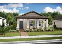 Charming single-story home with a welcoming front porch, beautiful landscaping, and blue accent shutters at 15120 Field Daisy Dr # 204, Winter Garden, FL 34787