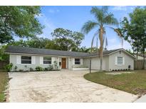 Charming single story home featuring manicured lawn and mature trees at 3520 Balsam Dr, Winter Park, FL 32792