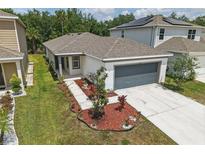 Charming single-story home with manicured lawn and a two-car garage, located in a desirable neighborhood at 5079 Royal Point Ave, Kissimmee, FL 34746