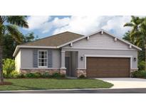 Charming single-story home featuring stone accents, grey exterior, and well-manicured lawn at 9169 Harris Hawk Dr, Leesburg, FL 34788