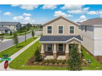 Charming two-story home with manicured lawn and curb appeal at 11807 Charades St, Orlando, FL 32832