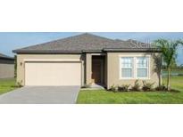 Charming single-Gathering home boasts a well-maintained lawn, garage and neutral color scheme at 3251 Nightfall Rd, Winter Haven, FL 33881