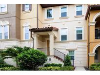 Inviting townhome showcases a well-manicured lawn and a charming facade, creating a warm and welcoming curb appeal at 625 Pavia Loop, Lake Mary, FL 32746