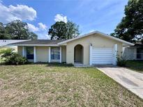Charming single-story home with a one car garage and well-lit entry at 117 N Alderwood St, Winter Springs, FL 32708