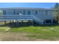 Charming home exterior with raised porch and light blue painted wood at 14330 Ellerbee St, Winter Garden, FL 34787