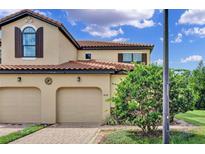 Charming two-story home with a two-car garage and well-maintained landscaping at 8124 Roseville Rd, Davenport, FL 33896