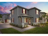 Charming two-story home with red shutters, manicured landscaping, and a brick pathway at 3039 Meleto Blvd, New Smyrna Beach, FL 32168