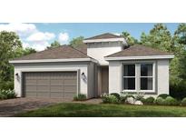 Charming single-story home with a two-car garage and manicured front lawn at 4209 Barbuda Ln, Kissimmee, FL 34758