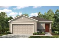 Charming single-story home with a two-car garage, stone accents, and well-manicured landscaping at 491 Wayland Dr, Haines City, FL 33844