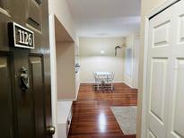 Inviting living room features wood floors and plenty of natural light at 2314 Mid Town Ter # 1126, Orlando, FL 32839