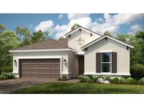Attractive single-story home with a brown roof, tan stucco siding, and a two-car garage at 4204 Barbuda Ln, Kissimmee, FL 34758