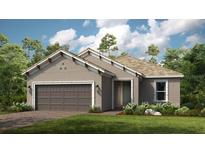 Charming one-story home featuring a two-car garage and manicured front lawn at 4210 Barbuda Ln, Kissimmee, FL 34758