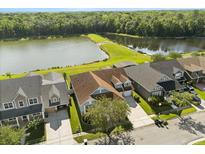 Aerial view of home with lake view, showcasing lush greenery and water at 4608 Atwood Dr, Orlando, FL 32828