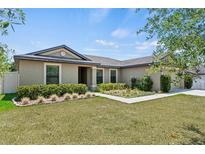 Charming single-story home featuring a landscaped front yard and a welcoming entrance at 337 Southern Winds Blvd, Deland, FL 32720