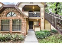 Charming condo with brick accents, balcony, and well-maintained landscaping at 485 Forestway Cir # 108, Altamonte Springs, FL 32701