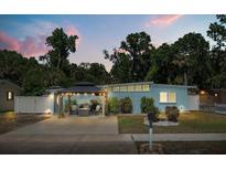 Charming single-story home with a covered outdoor seating area and well-maintained landscaping at 793 Greenway Pl, Daytona Beach, FL 32114