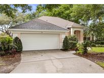 Charming single-story home with a well-manicured lawn and a spacious two-car garage at 926 Ridgeland Ct, Apopka, FL 32712