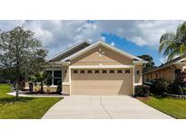 Charming single-story home with a well-manicured lawn and a two-car garage, perfect for comfortable living at 15637 Carina Dr, Orlando, FL 32828