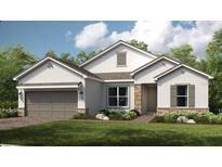 Charming single-story home with stone accents, neutral colors, and a well-manicured lawn, perfect for curb appeal at 5652 Nevis Ter, Kissimmee, FL 34758