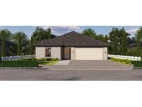 Charming single-story home featuring a brick exterior, a two-car garage, and a beautifully maintained front yard at 143 Jessamine Ln, Lady Lake, FL 32159