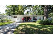 Charming single-story home featuring a well-manicured lawn and an inviting, covered front entrance at 2114 Mount Vernon St, Orlando, FL 32803