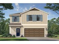 Charming two-story home with a two-car garage, blue shutters, and stone accents at 3255 Cup Dr, Lakeland, FL 33803