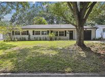 Charming single-story home with a well-maintained lawn and mature trees in a desirable neighborhood at 3520 N Westmoreland Dr, Orlando, FL 32804