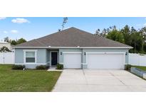 Charming single-story home with a two-car garage and well-maintained lawn at 4811 Sw 108Th Place Rd, Ocala, FL 34476