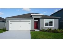 Charming single-story home with a two-car garage and red front door at 5860 Galloping Dr, Apopka, FL 32712