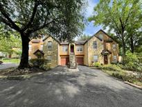 Beautiful townhome complex with private parking and mature landscaping providing shade and curb appeal at 6400 Raleigh St # 3015, Orlando, FL 32835