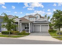 Charming two-story home with a manicured front yard and a two-car garage, perfect for suburban living at 14189 Larkspur Lake Dr, Winter Garden, FL 34787