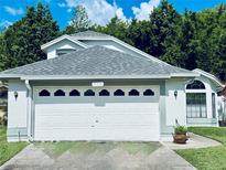 A well maintained single Gathering house with a two car garage and nice landscaping at 11714 Peachstone Ln, Orlando, FL 32821