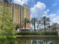 Beautiful resort featuring a tall building and pool with a pirate ship theme at 8125 Resort Village Dr # 5808, Orlando, FL 32821